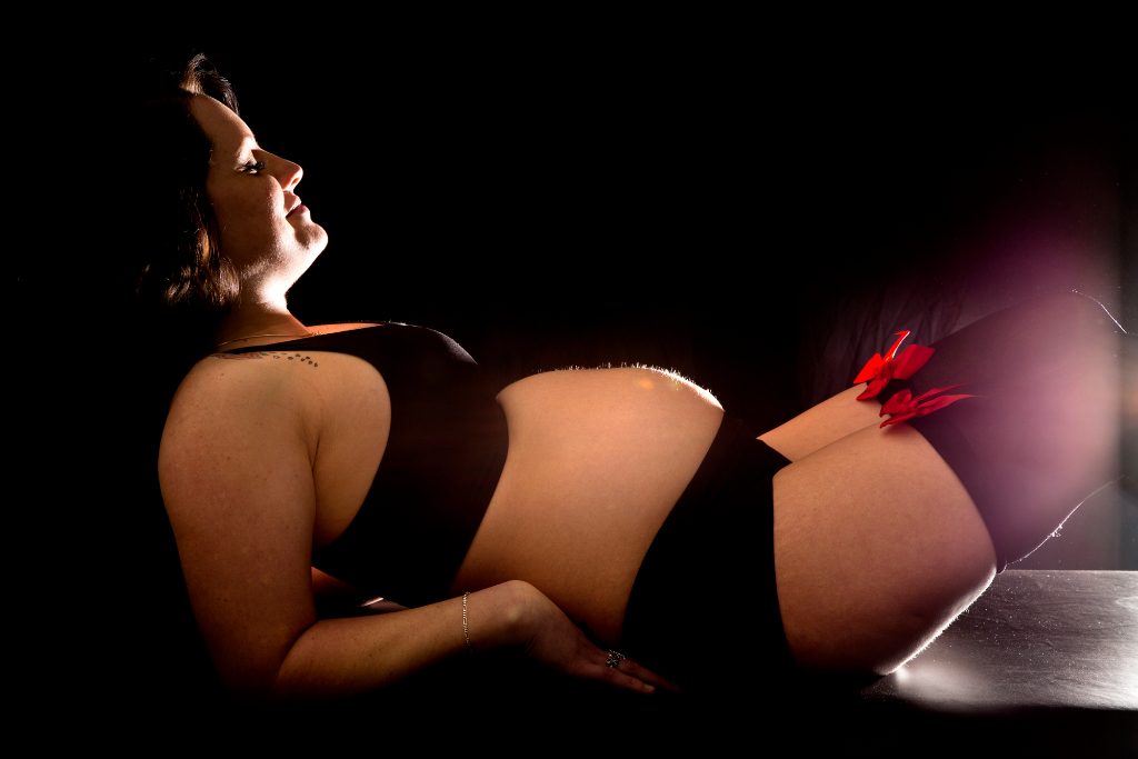 Pregnant Woman Posing In Shorts